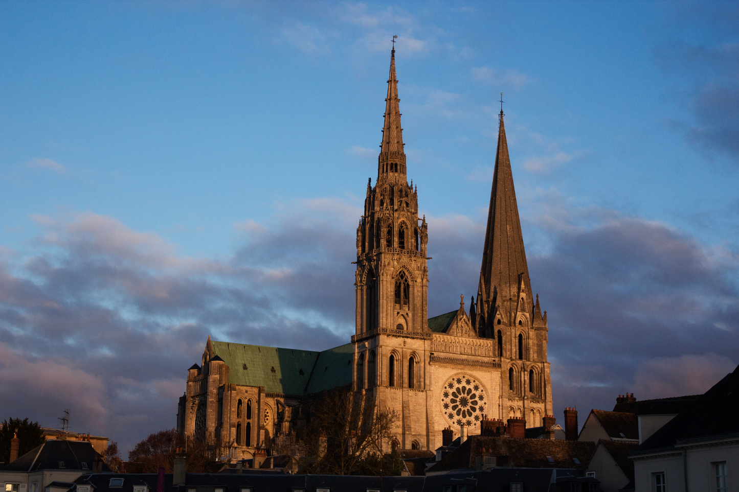 Tower Notre Dame de Chartres Cathedral blue sky grey clouds excursion trip day trip from Paris