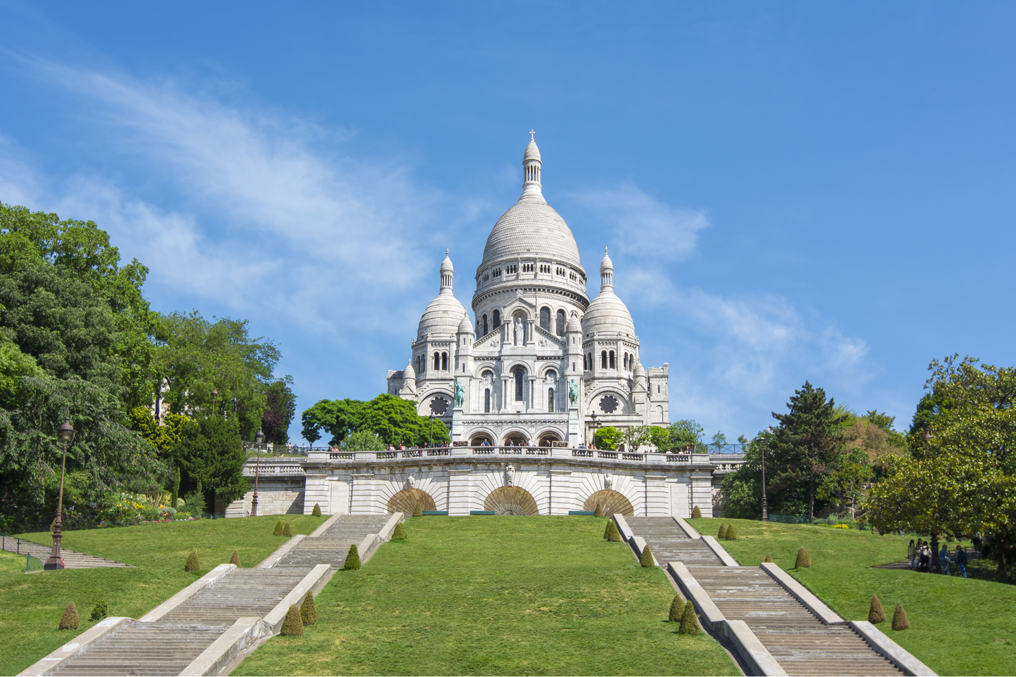 Sacre Coeur Basilica Church in Paris Montmartre green grass steps empty