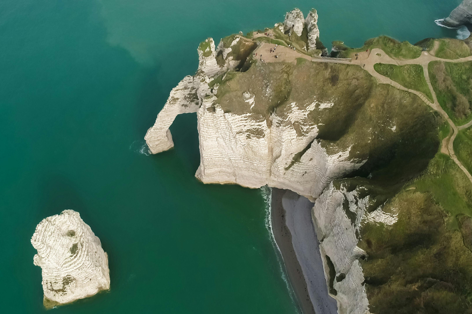 Étretat drone footage normandy landscapes green grass blue water excursion day trip from Paris